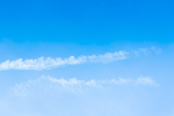 The blue backdrop has some clouds.
