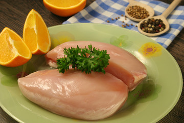 Raw chicken breast and spices close up. Selective focus