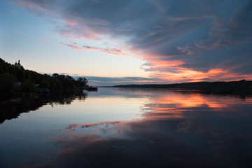 Fototapeta na wymiar Summer sunset on the Volga river. European part of Russia. Small town of Ples.