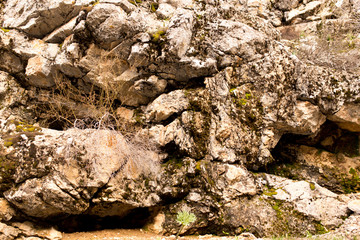 Stone cliffs in the mountains as a background