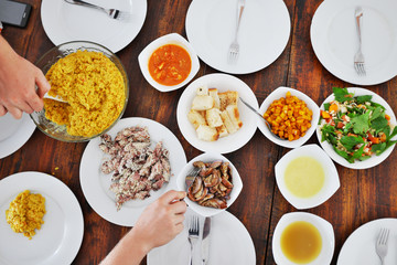 Top view of plates with different food on the table
