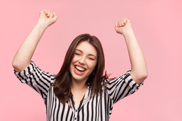 Fototapeta premium Woman posing with hands up