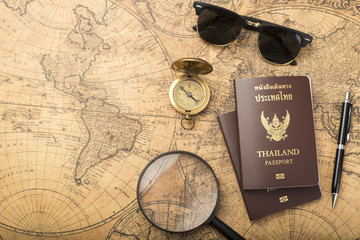 Fototapeta na wymiar Planning travel concept, Thailand passport on old map