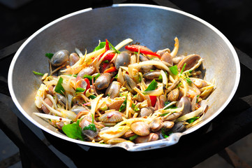 Step stir fried clams with roasted chili paste, stir fried in pan