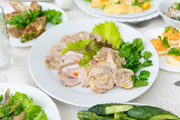 A fragrant delicious meatloaf, decorated with greenery close-up.