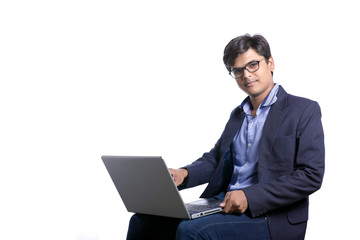 indian man working on laptop