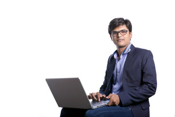 indian man working on laptop