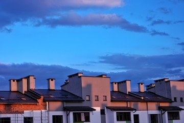 Fototapeta na wymiar City sunset over rooftops