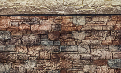 Wall of hard facing stone