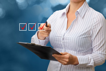Businesswoman Hand Checking the Checking Box .