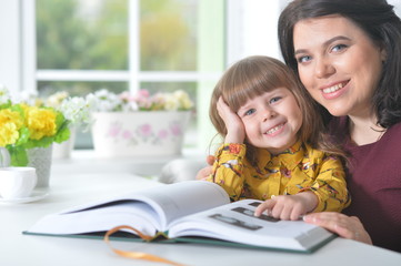 Mother reading  with her daughter