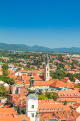     Zagreb center, aerial view, rooftops and church towers, Medvednica mountain in background 