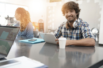 Portrait of man working in office, start-up