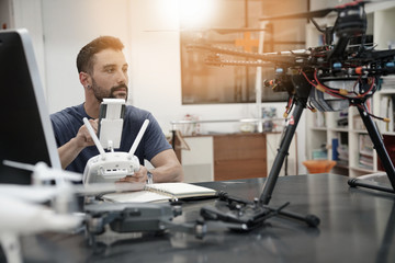 Fototapeta premium Engineer working on drone in office