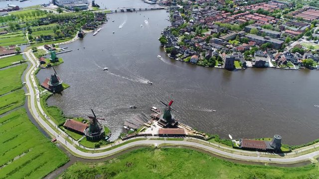 Aerial overview of famous Zaanse Schans windmill moving down slowly the Zaanse Schans is popular tourist attractions of the Netherlands and an anchor point of European Route of Industrial Heritage 4k