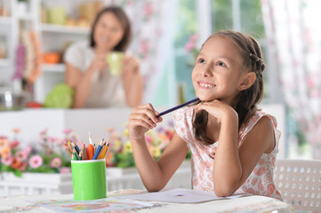  girl drawing  at home