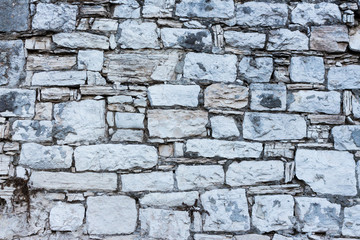 white stones in a very regular wall
