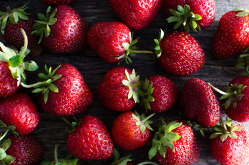 Ripe red strawberries with vibrant lighting