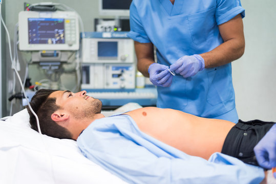 Medic preparing patient for procedure