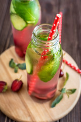 Detox water infused with fruits. Summer water fruit on rustic background