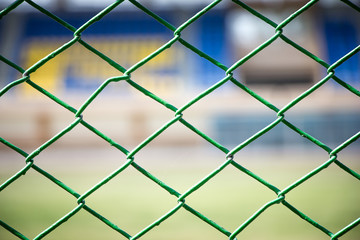 Fototapeta premium Wire fence with stadium