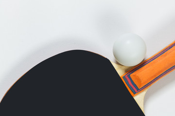 Table tennis racket and ball on a white background