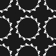 Repeated round elements from the silhouettes of cats. Seamless pattern.