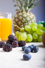 Close up of Kiwi mulberry and blueberry on white table