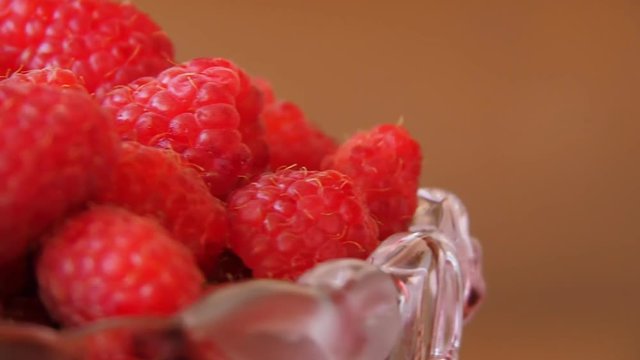 Raspberry close-up. Fresh raspberries in a glass jar.