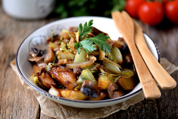 Stewed potatoes with mushrooms, onions, cabbage and garlic with olive oil.