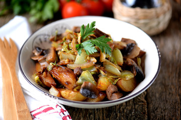 Stewed potatoes with mushrooms, onions, cabbage and garlic with olive oil.