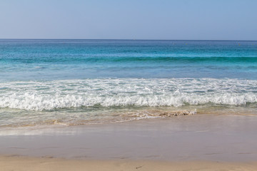 Fototapeta na wymiar White sand beach and blue sky.