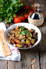 Stewed potatoes with mushrooms, onions, cabbage and garlic with olive oil.