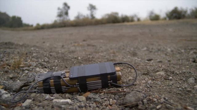 IMPROVISED EXPLOSIVE DEVICE (IED) ROADSIDE.  Slow dolly move.