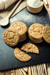 Biscuit sweet cookie background. Domestic stacked butter biscuit pattern concept,close up macro.Homemade cookies on wooden table.Cereal biscuits with the sesame,peanuts,sunflower and amaranth.