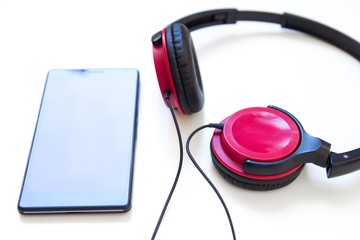 Headphones and smartphone isolated on white background