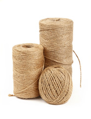 Burlap jute twine coil bobbins isolated on white