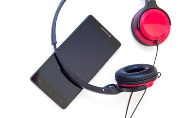 Headphones and smartphone isolated on white background