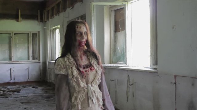 Zombies walk in an abandoned house. Montage.