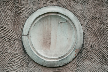 Close-up of decorative gray outlet on the house can be used for labels and signs. Decorative wall panel, antique furniture vintage home. Element façade