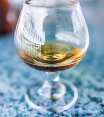 Macro closeup of amaretto, rum, or bourbon drink in glass