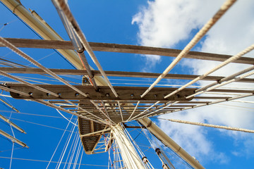 masts of sail vessel on sky background