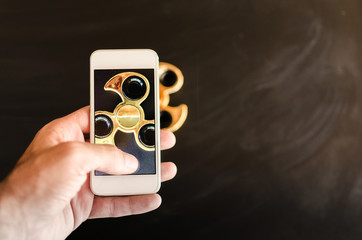 man making photo of spinner