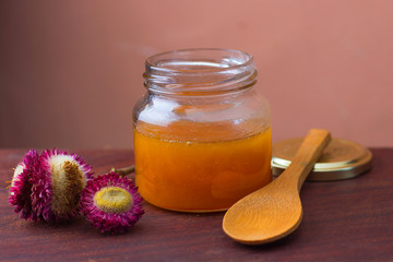 Wild honey in glass jar