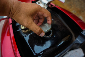The oil must be added to the fuel tank to fill up to continue.