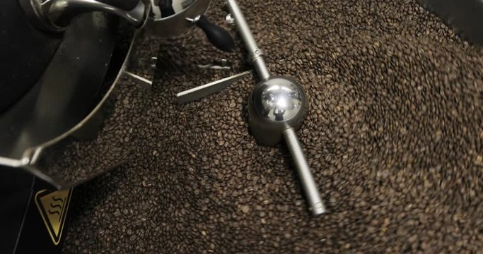 Roasting Coffee Beans Whirling Mixed On Cooling Unit Platform In A Manufactory Workshop