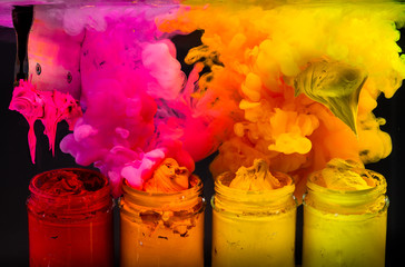 Fototapeta na wymiar splash water color ink into the hot tone color of plastisol ink