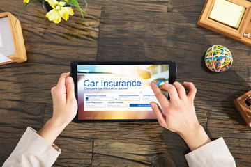 Businessperson Filling The Car Insurance Form