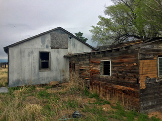 Fototapeta na wymiar Old abandoned western wooden building left in disrepair