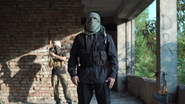 Terrorist looking at camera and talking while delivering video message.